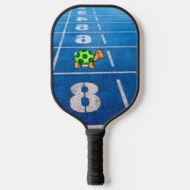 A turtle in a marathon race pickleball paddle (Front)