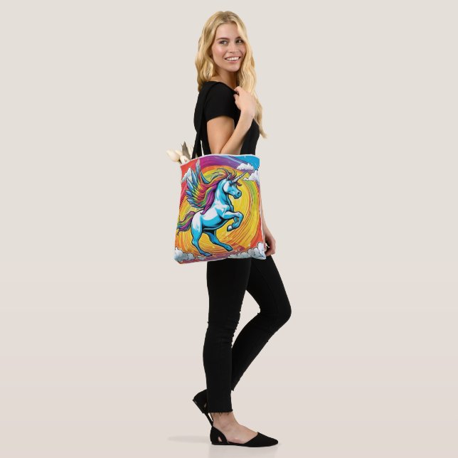 A Unicorn Flying with a Rainbow Tote Bag (On Model)