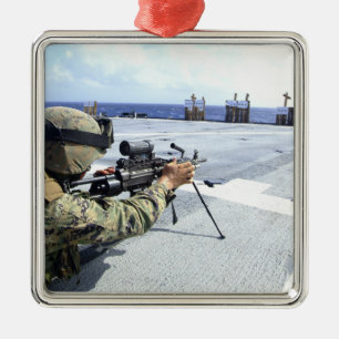 A US Marine adjusting his weapon Metal Ornament