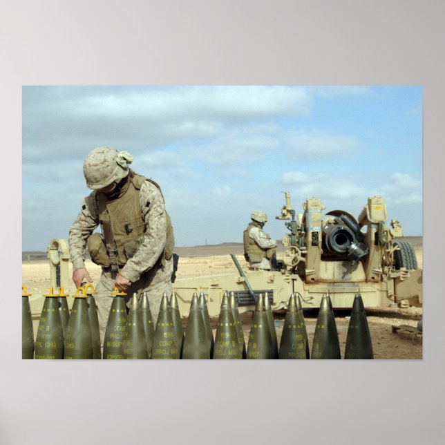 A US Marine prepares howitzer rounds to be fire Poster (Front)