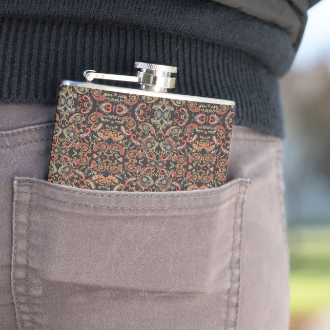 a very ornate pattern with many different colours hip flask (In Situ)