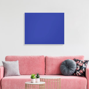 A vibrant blue backdrop with a clean white square canvas print