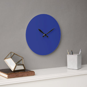 A vibrant blue backdrop with a clean white square  large clock