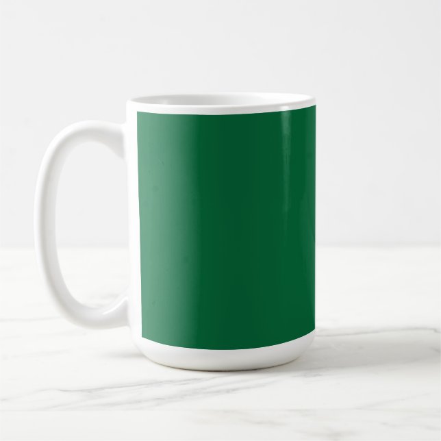 A vibrant green leaf with distinct veins is illumi coffee mug (Left)