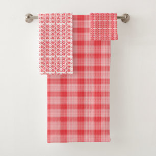 A vibrant red rose with dewdrops gently resting on bath towel set
