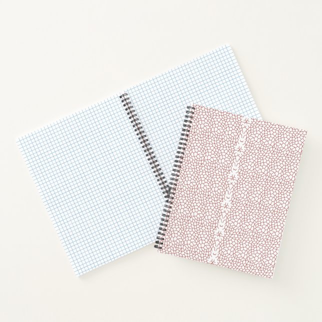 A vibrant rug featuring an intricate geometric mot notebook (Inside)