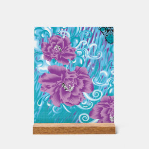 A vibrant textile design featuring purple and turq acrylic sign