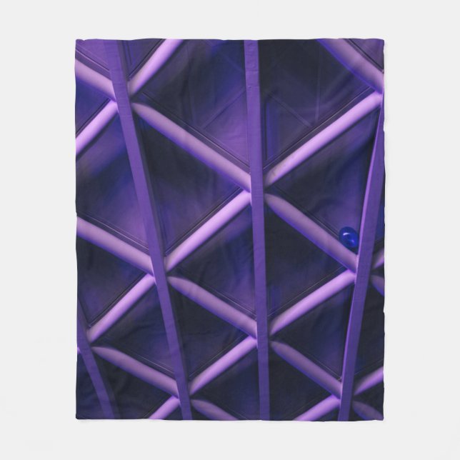 A violet ceiling with a criss-cross pattern; a blu fleece blanket (Front)