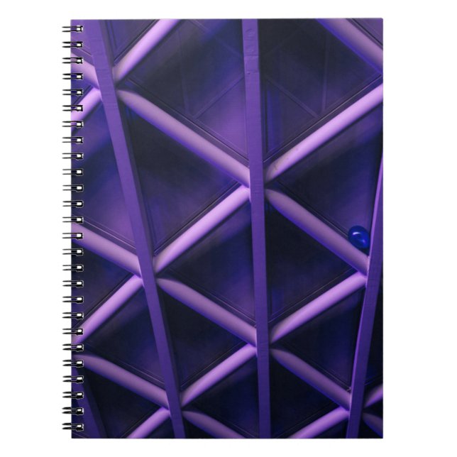 A violet ceiling with a criss-cross pattern; a blu notebook (Front)