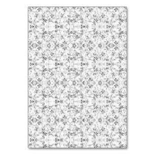 A visually striking white and black patterned wall table number