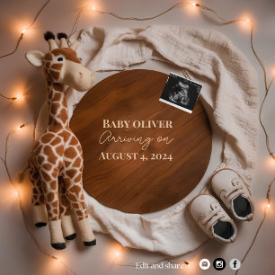 A warm cosy giraffe pregnancy announcement 