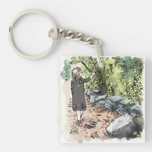 a water color illustration of a woman walking alon key ring