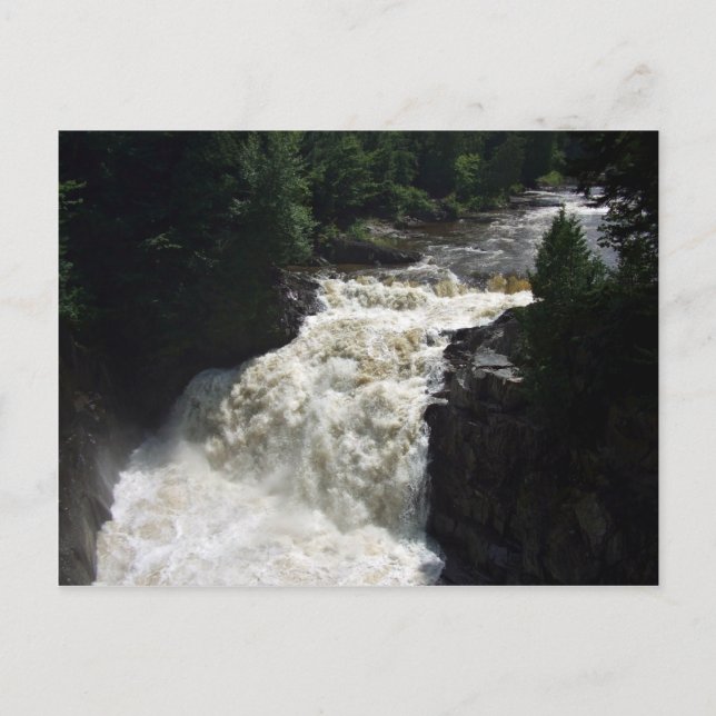 A waterfall with trees and rocks postcard (Front)