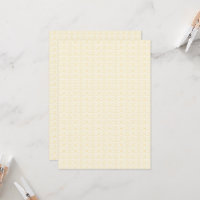 a white and gold wallpaper with a pattern on it