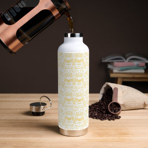 a white and gold wallpaper with a pattern on it water bottle