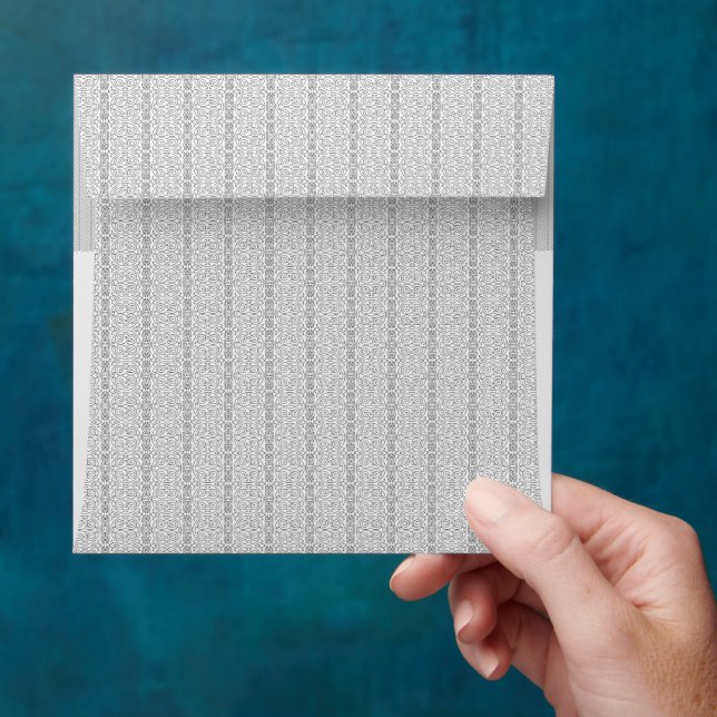 a white and grey wallpaper with a pattern on it envelope (Hand)