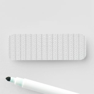 a white and grey wallpaper with a pattern on it name tag