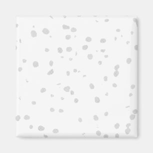 a white background with a lot of small dots magnet