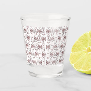 a white background with a red pattern on it shot glass