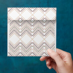 a white background with brown and red dots envelope