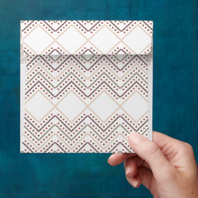 a white background with brown and red dots envelope (Hand)