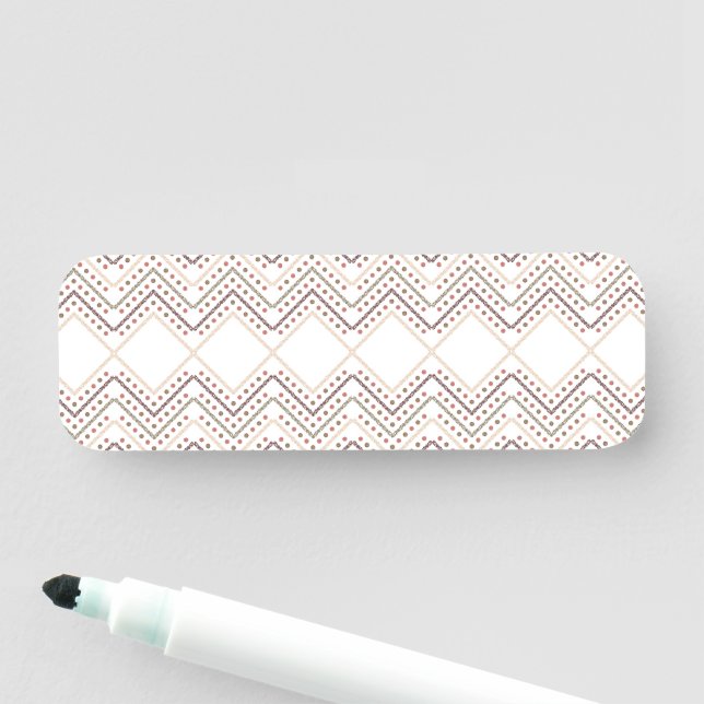 a white background with brown and red dots name tag (In Situ)