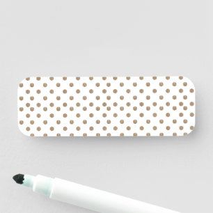 a white background with brown polka dots name tag