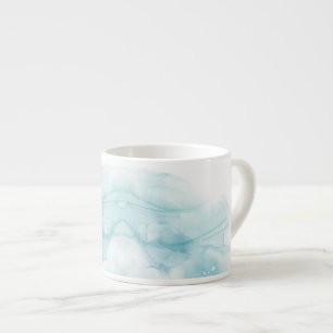 A white ceramic mug with a pale blue watercolor