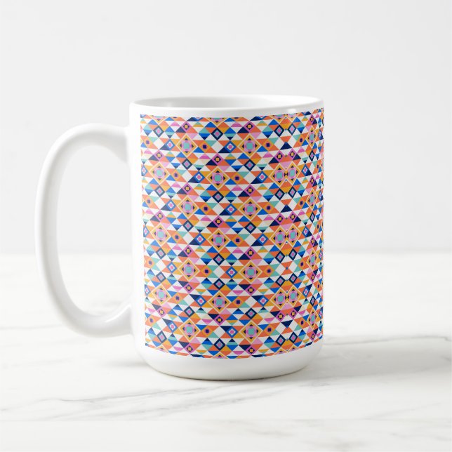 A white mug features a vibrant geometric pattern (Left)