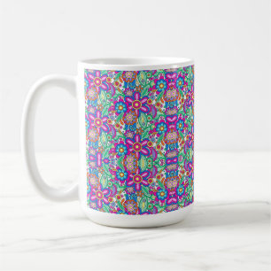 A white mug featuring a vibrant, colourful mandala