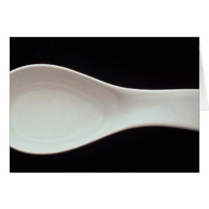 A white porcelain spoon
