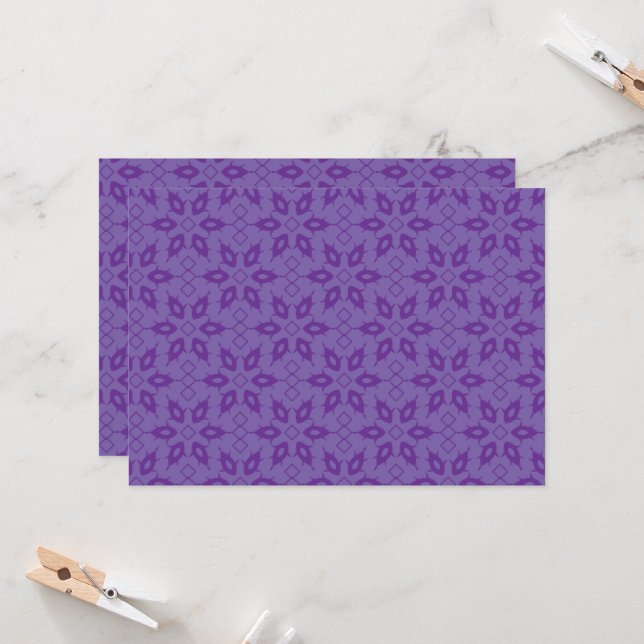 A white wrapping paper with a repeating pattern of invitation (Front/Back In Situ)
