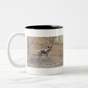 A Wild(Painted) Dog Stands In The Bush, Zambia. Two-Tone Coffee Mug