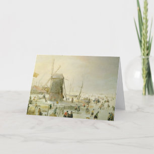 A winter scene with skaters by a windmill holiday card