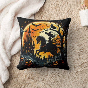 A witch rides under a spooky harvest moon cushion
