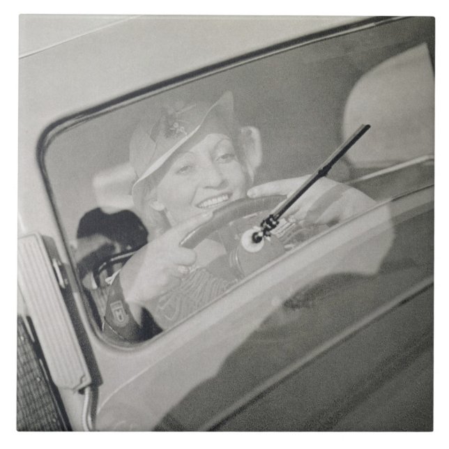 A woman driving, c.1930s (photogravure) ceramic tile (Front)
