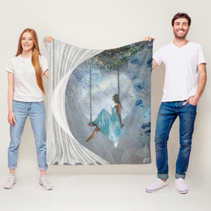 A woman in a blue dress on a swing  fleece blanket