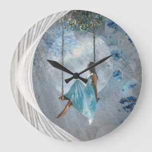 A woman in a blue dress on a swing large clock