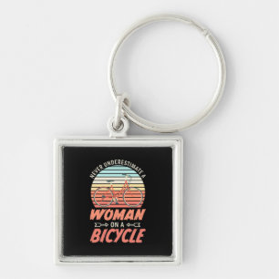A Woman On A Bicycle Key Ring