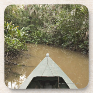A wooden canoe made of Eucylptus tree floats in 2 Coaster