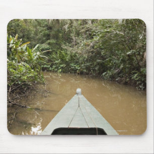 A wooden canoe made of Eucylptus tree floats in 2 Mouse Pad