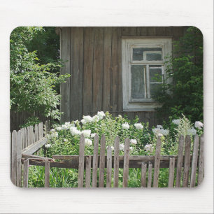 A wooden hut mousepad