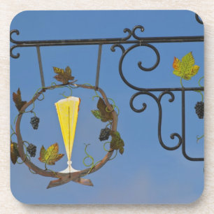 A wrought iron sign that illustrates the theme coaster