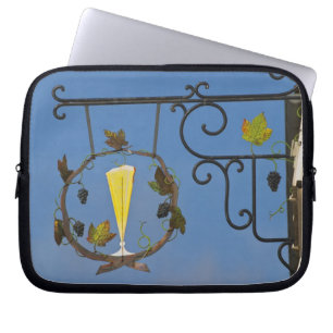 A wrought iron sign that illustrates the theme laptop sleeve
