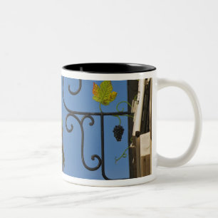 A wrought iron sign that illustrates the theme Two-Tone coffee mug