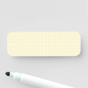 a yellow and white background with small circles name tag