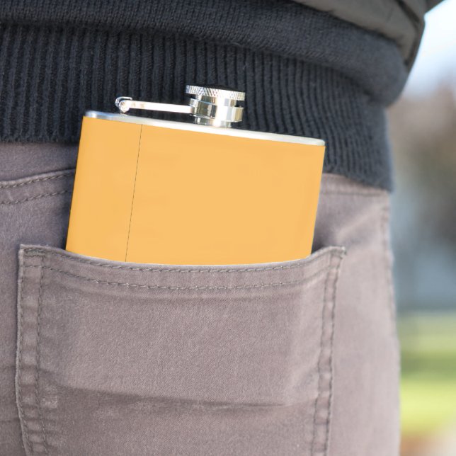 a yellow background with a black border hip flask (In Situ)