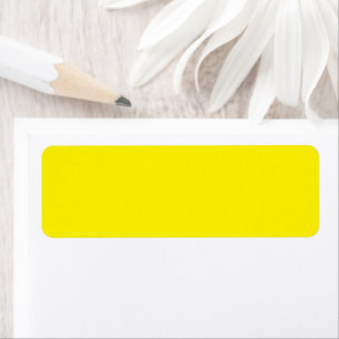 a yellow background with a black border return address label