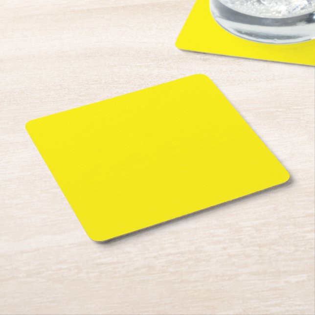 a yellow background with a black border square paper coaster (Angled)