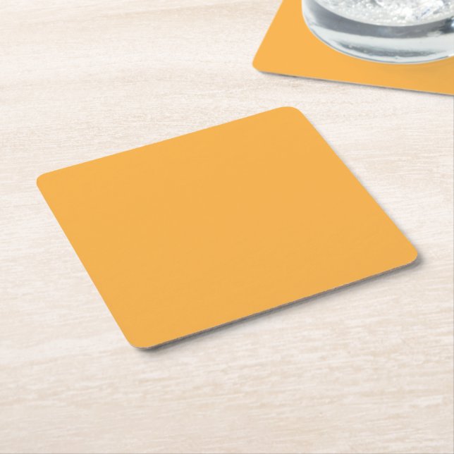 a yellow background with a black border square paper coaster (Angled)